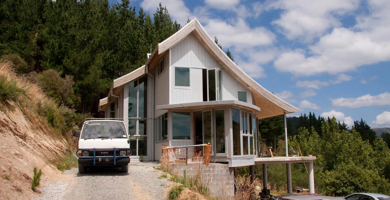 Nicholls House under construction, viewed along the hillside